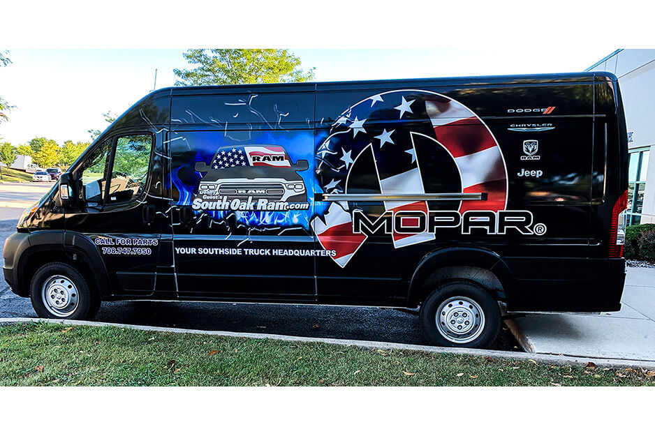 Black Mopar van with patriotic graphics