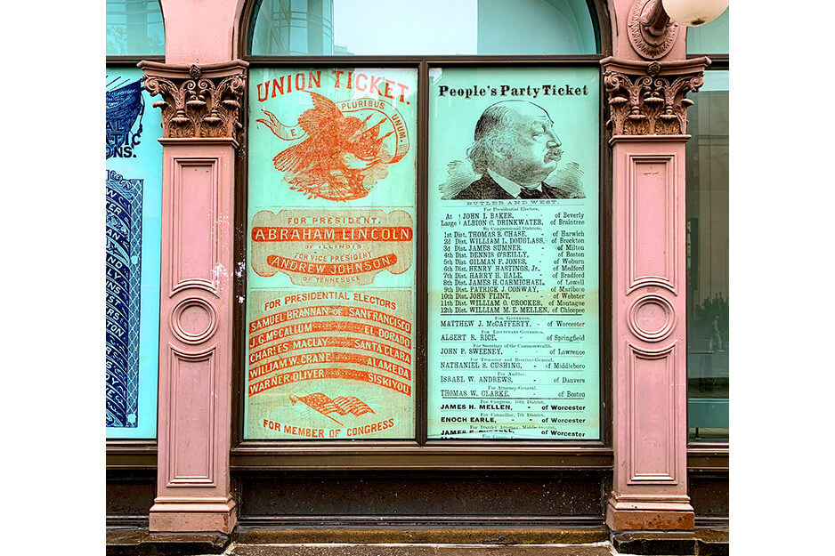 Graphics depicting antique scenes cover windows between columns. The graphics were printed on a Roland DG TrueVIS VG2 printer/cutter.