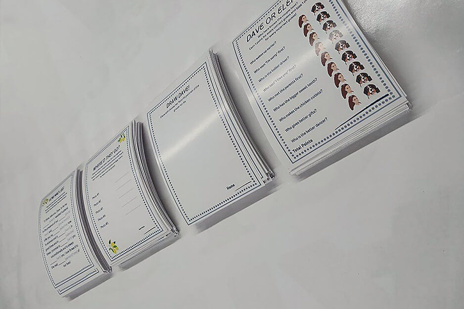 Four stacks of game cards for a game about Dave