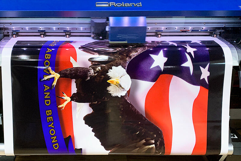 Patriotic graphics printed on vinyl roll off of a Roland DG wide-format digital printer-cutter.
