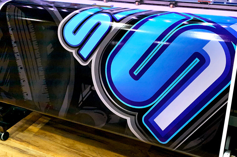 Colorful blue, white and black vinyl graphics printing on a Roland DG TrueVIS VG2 digital printer/cutter.