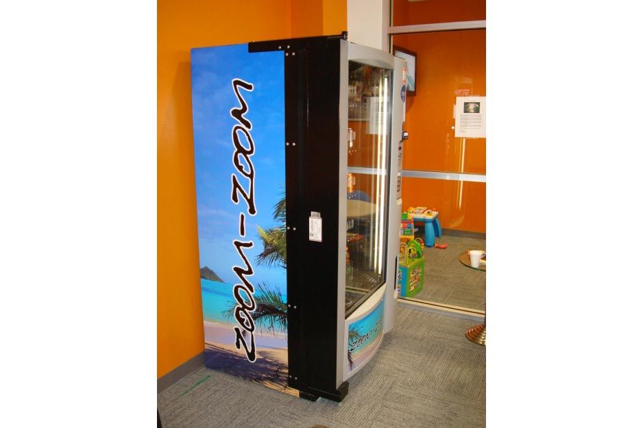 Ocala Auto Graphics VersaCAMM SP vending machine wrap
