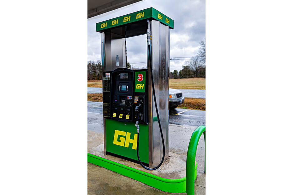 Image of a gas pump with green and yellow graphics printed using a Roland DG TrueVIS printer/cuter