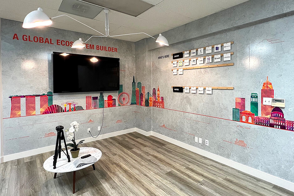 Colorful wall wrap on two walls showing global ecosystem printed using AP-640 resin ink printer