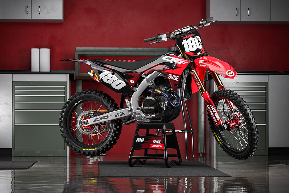 Motocross bike with red and white graphics and racing number 180