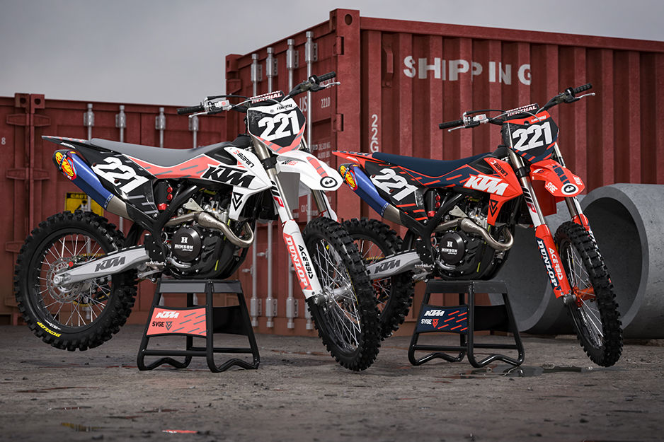 Two motocross racing bikes with colorful graphics