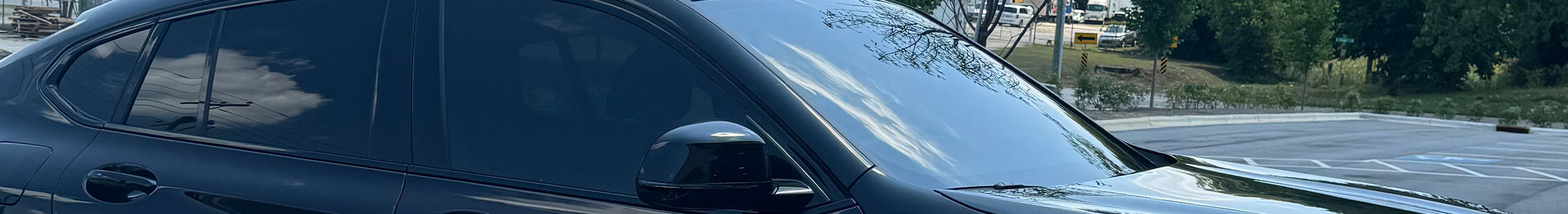 Black car with tinted windows.