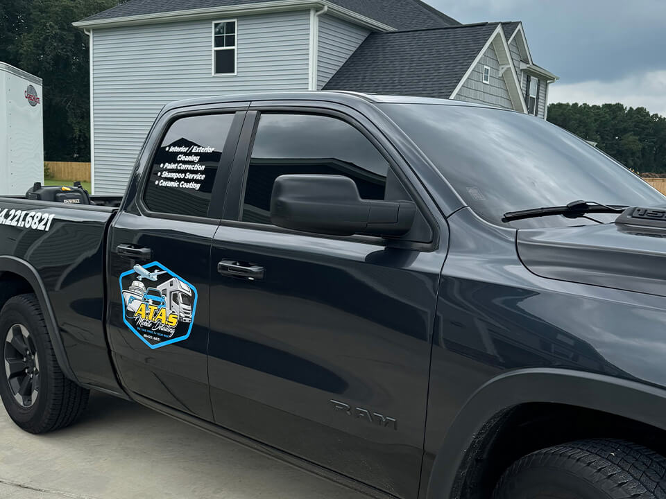 Black pick-up truck with tinted windows