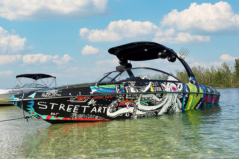 Inked Vinyl printed these vibrant boat graphics using its Roland DG TrueVIS VG2-640 wide format digital printer-cutter.