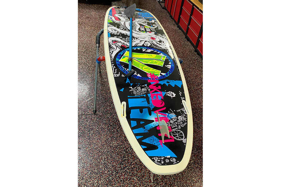 Inked Vinyl printed vibrant graphics for a surfboard on its Roland DG TrueVIS VG2-640 wide-format printer-cutter.