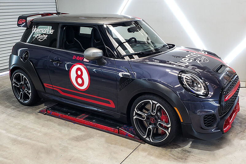 Team Acme uses its Roland DG TrueVIS VF2-640 to produce dynamic vehicle graphics like this blue Mini Cooper.