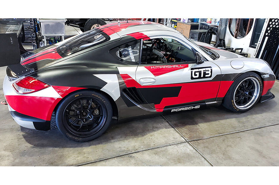 Colorful wraps like this red, black and white geometric design are a specialty at Team ACME, produced on their Roland DG TrueVIS VF2-640 wide-format printer.