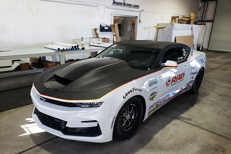 This black and white vehicle wrap was produced by Team Acme on its Roland DG TrueVIS VF2 wide-format printer.