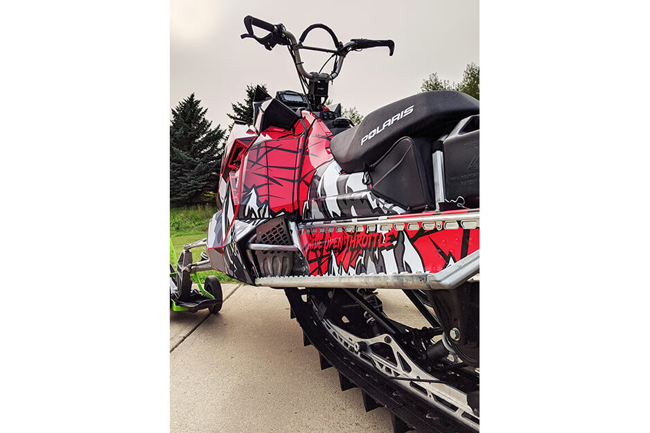 Chris Thiessen at Wide Open Throttle Graphics produces colorful snowmobile wraps on his Roland DG TrueVIS VG2-540 digital printer/cutter.