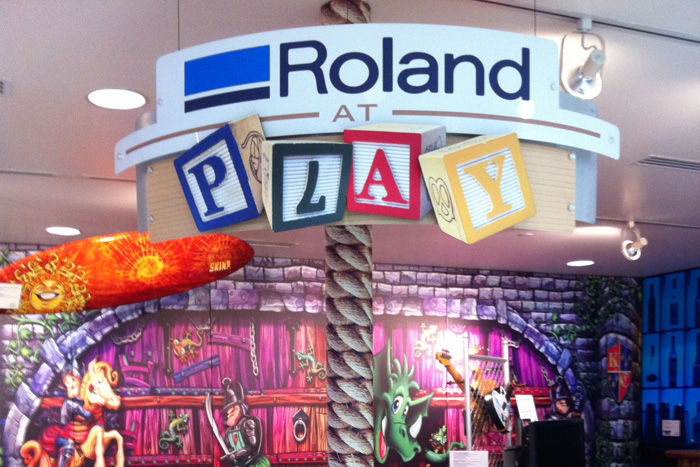 sectional sign Roland At Play